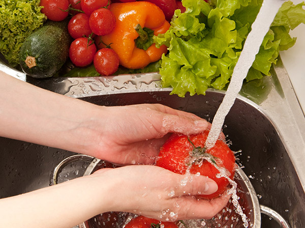 Hands Washing Tomato